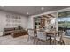 Comfortable covered patio featuring a dining area and lounge, offering a relaxing outdoor living space at 940 Club Cresswind Dr, Lady Lake, FL 32159