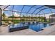 Stunning screened-in pool area with water feature and plenty of lounge seating, perfect for relaxation and enjoyment at 940 Club Cresswind Dr, Lady Lake, FL 32159