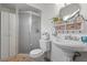 Clean and tidy bathroom featuring a shower, vanity sink, and storage cabinet at 978 N Jerico Dr, Casselberry, FL 32707