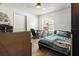 Bedroom featuring a ceiling fan, wood-look flooring, desk and closet at 978 N Jerico Dr, Casselberry, FL 32707