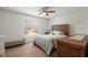 Cozy bedroom with a ceiling fan, neutral-toned walls, and a comfortable bed, creating a relaxing space at 978 N Jerico Dr, Casselberry, FL 32707