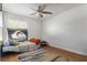 Bedroom featuring a ceiling fan, wood-look flooring and neutral walls at 978 N Jerico Dr, Casselberry, FL 32707