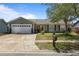 Charming single-story home featuring a two-car garage and a well-maintained front yard at 978 N Jerico Dr, Casselberry, FL 32707