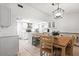 Bright, updated kitchen with white cabinets, stainless steel appliances, and a cozy dining area at 978 N Jerico Dr, Casselberry, FL 32707