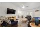 Comfortable living room with ceiling fan, tile floors, and sliding doors to the outdoor area at 978 N Jerico Dr, Casselberry, FL 32707