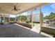 Enclosed patio featuring tile flooring, ceiling fan, and outdoor access at 978 N Jerico Dr, Casselberry, FL 32707