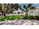 Well-maintained backyard with a privacy fence, lush greenery, and manicured landscaping at 100 Demens St, Oakland, FL 34760