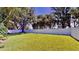 Spacious backyard featuring a well-manicured lawn and a white privacy fence at 100 Demens St, Oakland, FL 34760