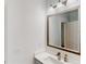 Modern bathroom featuring a vanity, countertop, decorative mirror, and sleek fixtures at 100 Demens St, Oakland, FL 34760