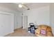 Bedroom features a cozy chair and desk area, perfect for studying or working from home at 100 Demens St, Oakland, FL 34760
