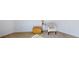 Cozy bedroom featuring a comfortable chair, ottoman, and side table creating a relaxing ambiance at 100 Demens St, Oakland, FL 34760