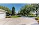Circular driveway leading to a well-maintained home with mature trees and landscaping at 100 Demens St, Oakland, FL 34760
