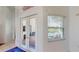 Bright foyer with access to the pool area providing seamless indoor-outdoor living at 100 Demens St, Oakland, FL 34760