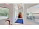 Bright foyer with high ceilings, tile flooring, and a view of the front yard at 100 Demens St, Oakland, FL 34760
