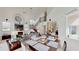 Open-concept living area with high ceilings, fireplace, and staircase at 100 Demens St, Oakland, FL 34760