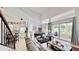 Open concept living room with high ceilings, lots of natural light, and view of the kitchen at 100 Demens St, Oakland, FL 34760