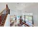Bright, open living space with high ceilings, large windows, and sliding doors to the pool area at 100 Demens St, Oakland, FL 34760