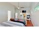 Open and airy main bedroom featuring wood floors, a fireplace, and a sitting area at 100 Demens St, Oakland, FL 34760