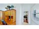 Cozy office nook with wooden built-ins and a view of the adjacent living area through an arched doorway at 100 Demens St, Oakland, FL 34760