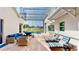 Comfortable outdoor seating and lounge chairs in a screened pool area at 100 Demens St, Oakland, FL 34760