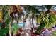 Gated access to the pool area with tropical landscaping and a screened enclosure at 100 Demens St, Oakland, FL 34760