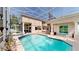 Spacious screened pool area with a spa, patio seating and multiple access points at 100 Demens St, Oakland, FL 34760
