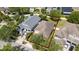 Overhead shot of a house with outlined boundary, highlighting the proximity to neighboring homes and greenery at 10076 Kimble Field Way, Orlando, FL 32827