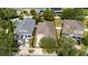 Aerial view of a home with a defined property line, showcasing the surrounding neighborhood and landscaping at 10076 Kimble Field Way, Orlando, FL 32827