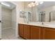 This primary bathroom has a double vanity and access to a large closet at 10076 Kimble Field Way, Orlando, FL 32827