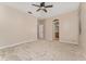 This carpeted bedroom has an attached bathroom and an additional door at 10076 Kimble Field Way, Orlando, FL 32827