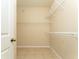 This large closet has wire shelving and tile floors at 10076 Kimble Field Way, Orlando, FL 32827