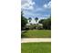 Charming community clubhouse with a well-manicured lawn and mature trees at 10076 Kimble Field Way, Orlando, FL 32827