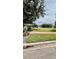 Beautiful common area with a picnic table, green space, and well-maintained landscaping at 10076 Kimble Field Way, Orlando, FL 32827