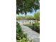 Community pool with plenty of chairs for relaxing and landscaped surroundings, a perfect oasis at 10076 Kimble Field Way, Orlando, FL 32827