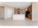 Functional kitchen featuring a center island, sleek appliances, and plenty of cabinet space at 10076 Kimble Field Way, Orlando, FL 32827