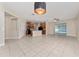 Open-concept living room with tile flooring that seamlessly connects to the kitchen at 10076 Kimble Field Way, Orlando, FL 32827