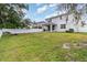 Spacious backyard with white vinyl fence, covered patio and lush green grass perfect for outdoor activities at 1073 River Otter Way, Deland, FL 32720