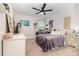 Well-lit bedroom features a dresser, bed, and large window at 1073 River Otter Way, Deland, FL 32720