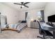 Brightly lit bedroom includes a bed, desk, and ceiling fan at 1073 River Otter Way, Deland, FL 32720