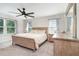 Spacious main bedroom with neutral color palette, ceiling fan and natural light at 1073 River Otter Way, Deland, FL 32720