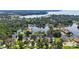 Stunning aerial view of waterfront homes surrounded by lush trees and tranquil waterways at 1085 Island Way, Leesburg, FL 34748