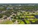 Aerial view of scenic parks and waterways, surrounded by lush greenery, offering a serene recreational area at 1085 Island Way, Leesburg, FL 34748