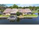 Waterfront home boasts a private dock and screened patio, perfect for lakeside relaxation and outdoor entertaining at 1085 Island Way, Leesburg, FL 34748