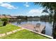 Private wooden dock extending into the lake, perfect for relaxing and enjoying water views at 1085 Island Way, Leesburg, FL 34748