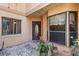 Inviting entryway with decorative door and potted plants at 1085 Island Way, Leesburg, FL 34748