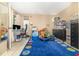 Bright, cheerful bedroom with colorful rug and versatile space for play or study at 109 Lakepointe Cir, Kissimmee, FL 34743