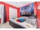 Vibrant bedroom with Disney-themed decor and a comfortable-looking bed at 109 Lakepointe Cir, Kissimmee, FL 34743