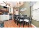 Cozy dining area with seating for six, seamlessly flowing into the adjacent kitchen at 109 Lakepointe Cir, Kissimmee, FL 34743