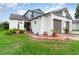 Inviting home exterior showcasing a lush green lawn, tiled entryway, and a well-maintained two-car garage at 109 Lakepointe Cir, Kissimmee, FL 34743