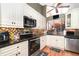 Well-equipped kitchen featuring stainless steel appliances, granite counters, and ample cabinet space at 109 Lakepointe Cir, Kissimmee, FL 34743